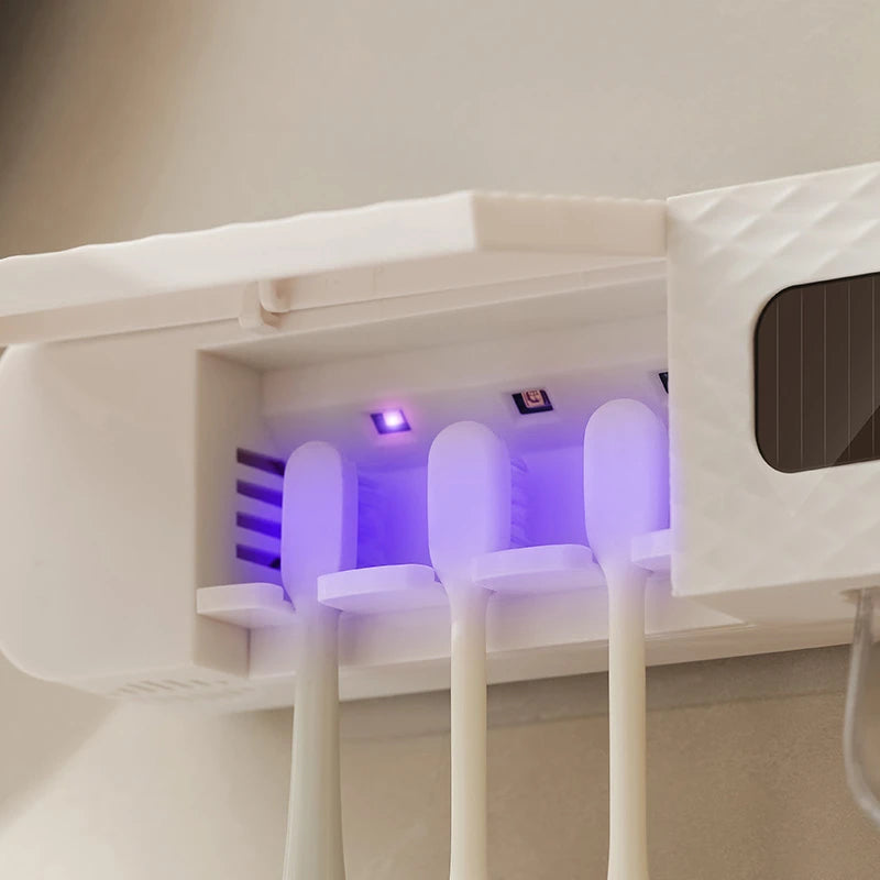 Toothpaste Dispenser on Smart Toothbrush Rack in a charging station with a purple light.