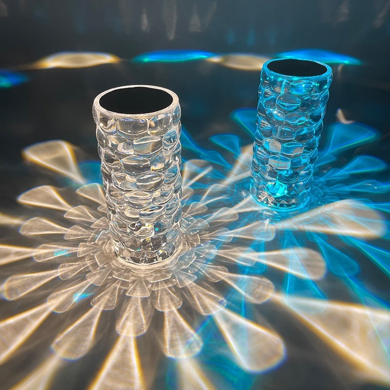 Two textured Crystal LED Touch Table Lamp on a reflective surface with colorful lighting